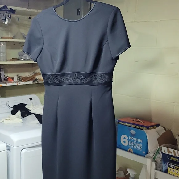 Ladies evening dress. Never worn. Beautiful sequins at waistline. Zipper in  back